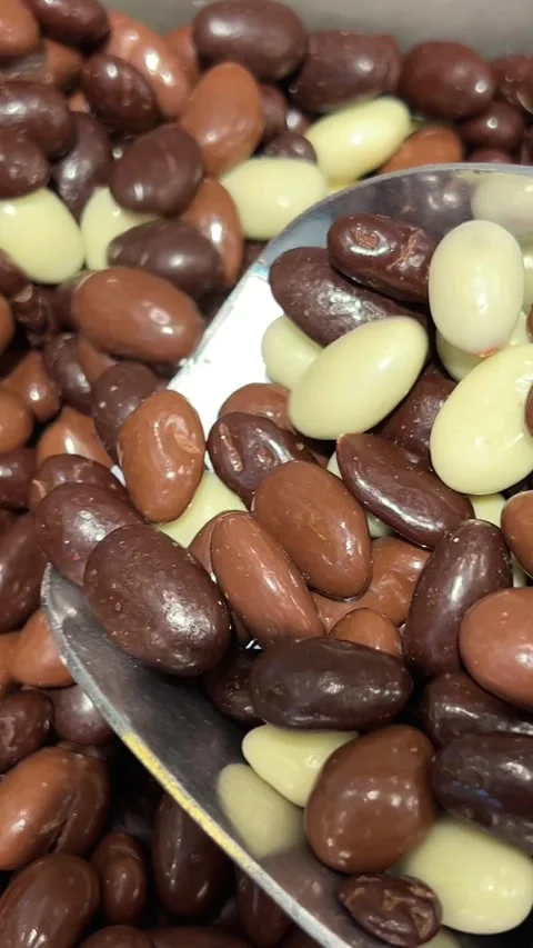 Chocolate covered nuts sweet nuts Stock Footage 316079520