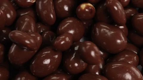 Chocolate-Covered Peanuts Falling in Slow Motion Stock Footage 306270181
