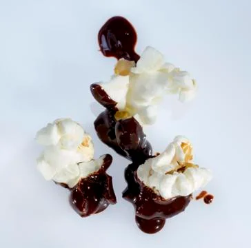 Chocolate covered popcorn. Stock Photos