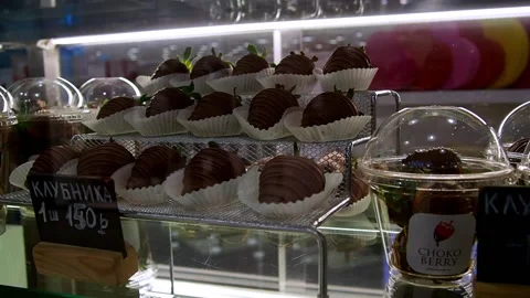 Chocolate-covered strawberries in a store window. Stock Footage 226631255
