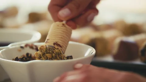 Chocolate covered waffle cone dipped in nuts Stock Footage 274629414