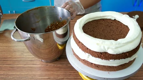 Chocolate cream on the cake Stock Footage 75514636