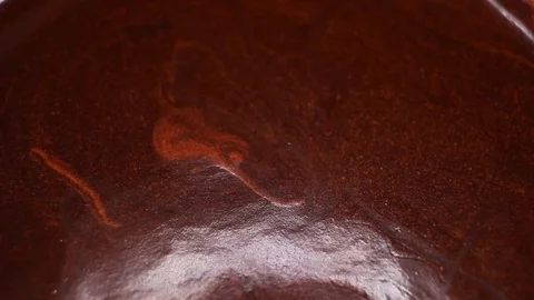 Chocolate cream closeup texture video on rolling rotating looping plate Stock Footage 104331019