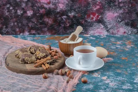 Chocolate crocante cookies with cinnamon flavour and a cup of tea Stock Photos