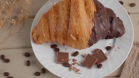 Chocolate Croissant with Coffee Beans Stock Footage 324914939