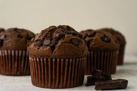 Chocolate cupcake with chocolate drops. Rustic wood background Stock Photos