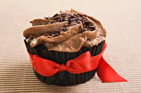 Chocolate cupcake with red bow Stock Photos