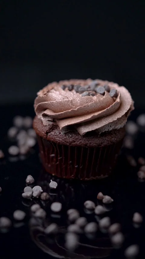 Chocolate Cupcake Rotating on Reflective Surface Stock Footage 330516823