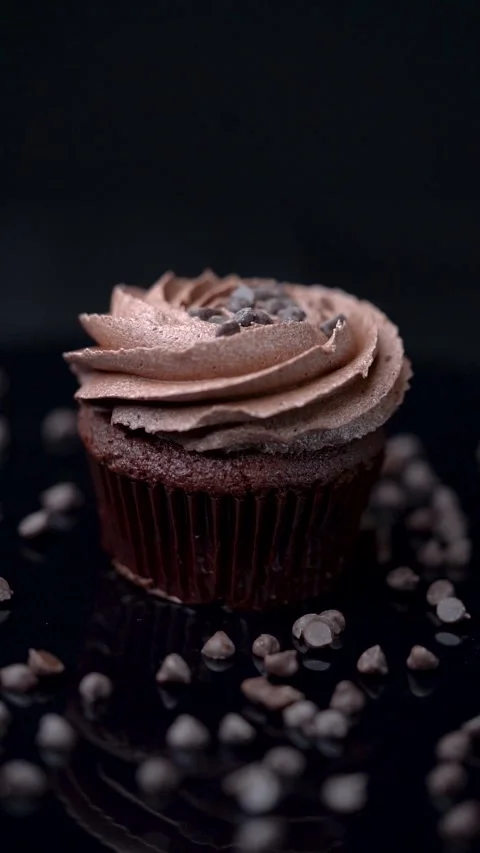 Chocolate Cupcake Rotating with Slow Camera Pan on Dark Background Stock Footage 330516826