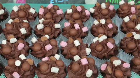 Chocolate cupcakes on display Stock Footage 31873249
