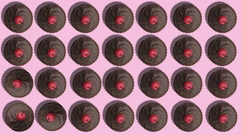 Chocolate cupcakes rotation pattern animation on pink abstract background Stock Footage 197426944