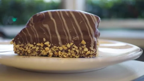 Chocolate dessert with nuts on a plate Stock Footage 342489142