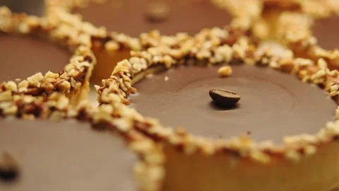 Chocolate dessert topped with nuts and coffee bean Stock Footage 340940367