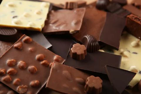 Chocolate of different types on a colored background with a place for text Fotos Stock