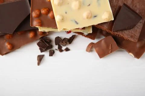 Chocolate of different types on a colored background with a place for text Fotos de archivo