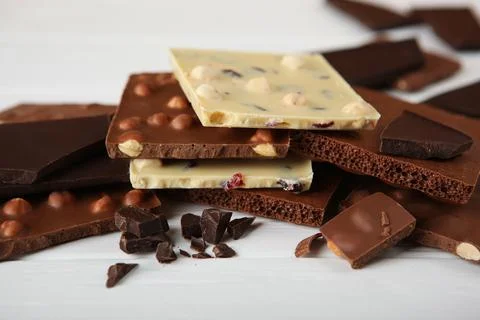 Chocolate of different types on a colored background with a place for text Stock-Fotos