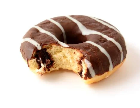 Chocolate donut with missing bite on white background Foto stock