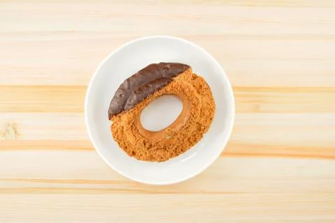 Chocolate donut placed in a dish Stock Photos