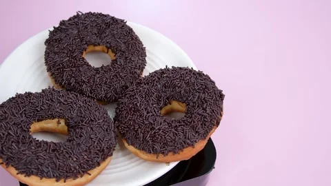 Chocolate donut with sprinkles Stock Footage 258014505