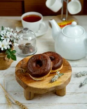Chocolate donuts with black tea Stock Photos