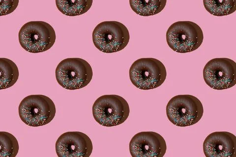 Chocolate donuts pattern on pink background. Top view, flat lay Foto stock