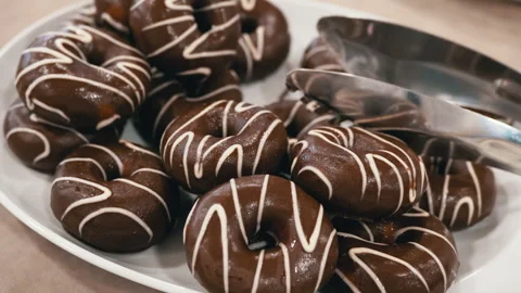 Chocolate Donuts on a Plate Stock Footage 293182637