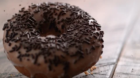 Chocolate doughnut falling. Slow Motion. Stock Footage 94078716