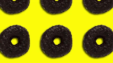 Chocolate doughnuts pattern on a red background. Minimal motion graphics food Stock Footage 148053082