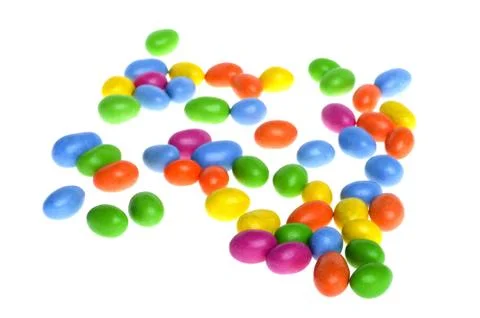 Chocolate dragee on white Stock Photos