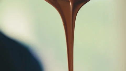 A Chocolate dripping off spoon Stock Footage 274631704