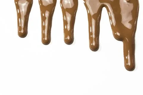 Chocolate   dropping or dripping on background Stock Photos