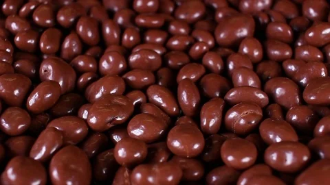Chocolate drops rotating texture pattern closeup footage Stock Footage 97230199