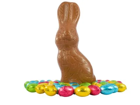 Chocolate Easter Bunny and eggs. Traditional Easter sweets. Stock Photos