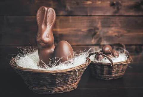 Chocolate Easter bunny inside a basket Stock Photos