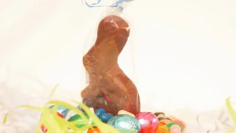 Chocolate Easter Bunny in Wrapper with Candy ROTATE RIGHT Stock Footage 105878896