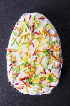 Chocolate Easter Egg and Cupcake On Black Background Stock Photos