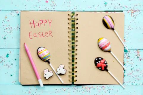 Chocolate Easter egg candie over a book Stock Photos