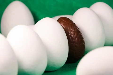 Chocolate Easter Egg With Candy Coated Eggs Stock Photos