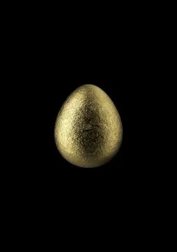 Chocolate easter egg with gold foil on black background. Stock Photos