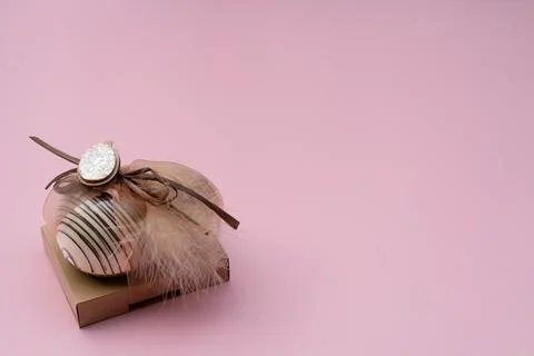 Chocolate Easter Egg in a package   on pink  Background with Copy Space Stock Photos