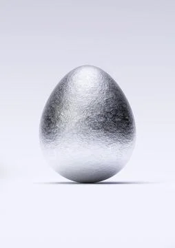 Chocolate easter egg with shiny silver Aluminium foil on white background. Stock Photos