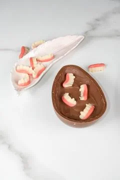 Chocolate Easter egg with strawberry and raspberry filling for children ver.. Stock Photos