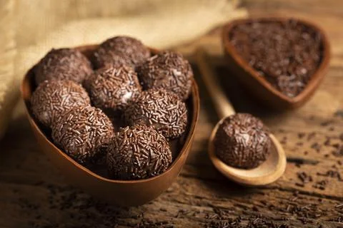 Chocolate Easter egg stuffed with brigadeiros. Stock Photos