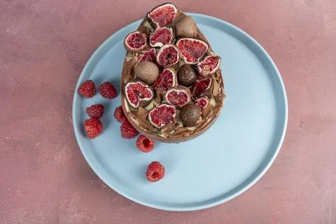 Chocolate Easter egg. Stuffed with white Brazilian truffle and raspberry ja.. Stock Photos