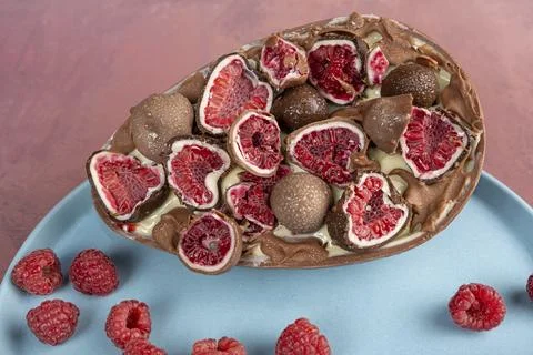 Chocolate Easter egg. Stuffed with white Brazilian truffle and raspberry ja.. Stock Photos