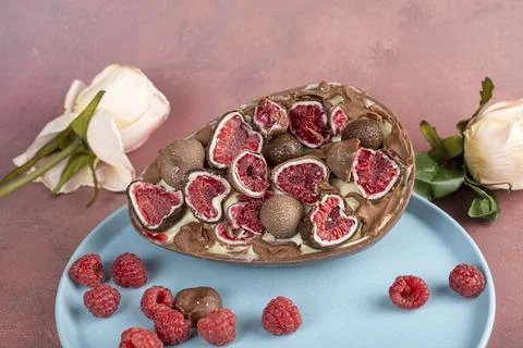 Chocolate Easter egg. Stuffed with white Brazilian truffle and raspberry ja.. Stock Photos