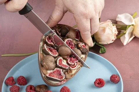 Chocolate Easter egg. Stuffed with white Brazilian truffle and raspberry ja.. Stock Photos
