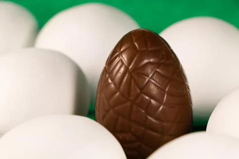Chocolate Easter Egg With White Coated Eggs Stock Photos