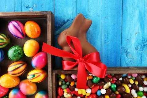 Chocolate Easter eggs and chocolate bunny and colorful sweets Stock Photos