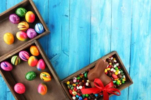Chocolate Easter eggs and chocolate bunny and colorful sweets Stock Photos